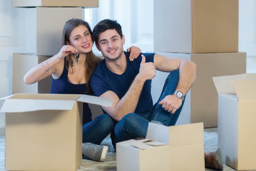 Professional movers handling fragile items during a local relocation
