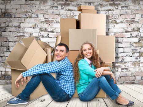 Packed boxes and furniture ready for transport by removals crew