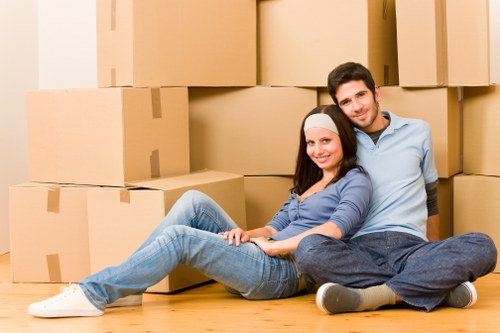 Packed boxes and furniture ready for loading during a house move