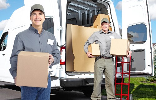 Packed moving boxes and furniture ready for removal services in Bickley