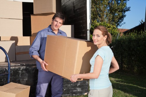 Business relocation preparation with labeled boxes and office supplies